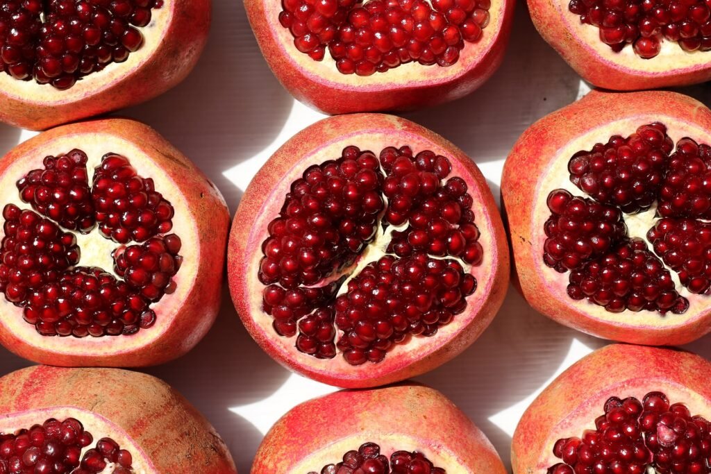 Pomegranate fruits sliced to show the seeds
